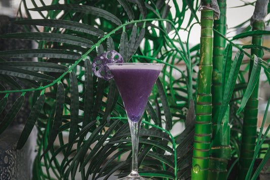 purple empress cocktail in champagne glass
