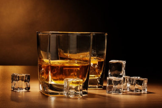 high west whiskey in two glasses by ice cubes