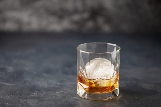 a glass of creek water whiskey with ice