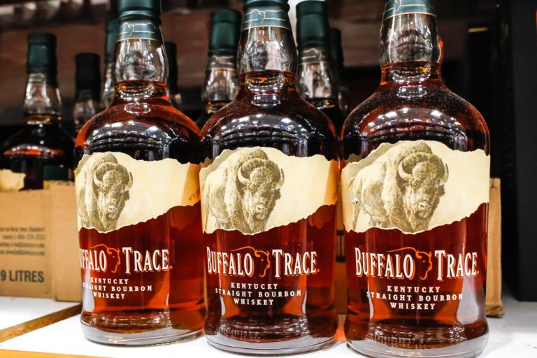 buffalo trace bourbon whiskey bottles on liquor shelf