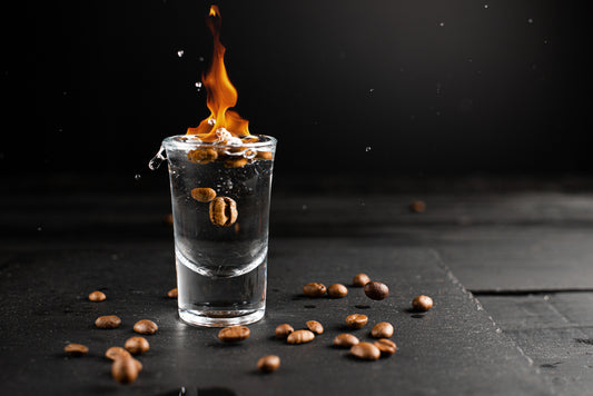 burning sambuca shot with coffee beans
