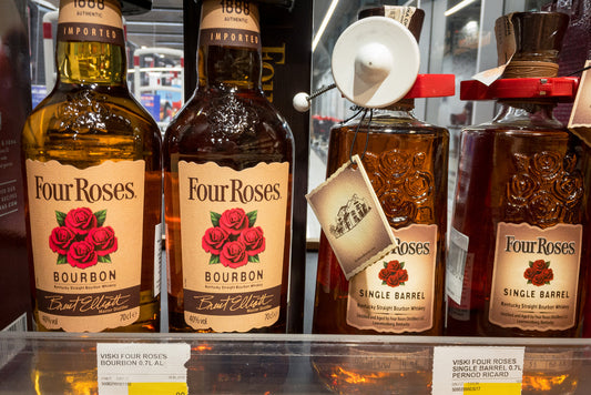four roses bourbon whiskey bottles on liquor store shelf
