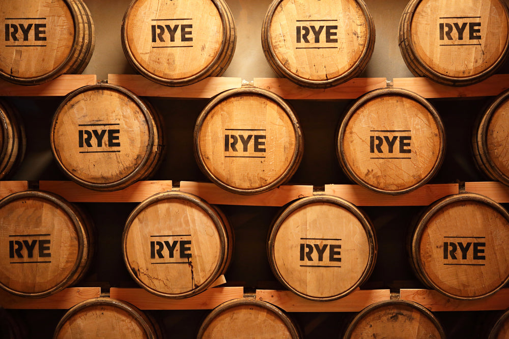 stacked rye whiskey barrels
