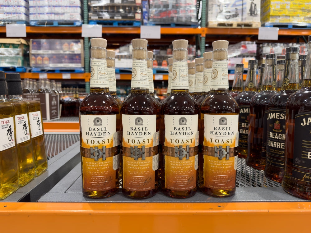 several basil hayden bourbon bottles in liquor store