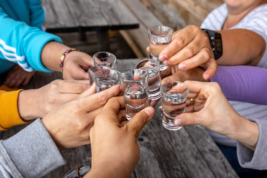 group of people toasting azunia tequila shots