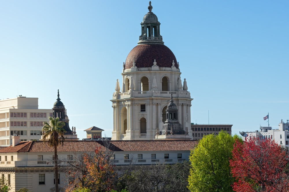 pasadena city hall during the day with trees and a clear blue sky