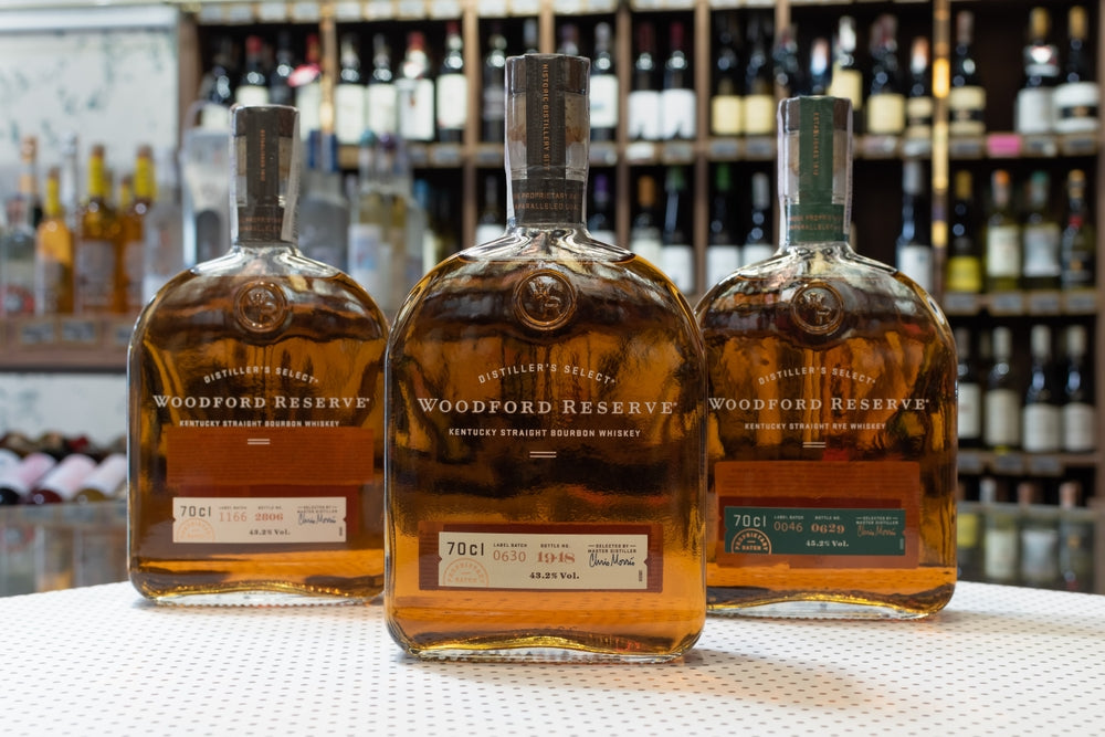 three bottles of woodford reserve